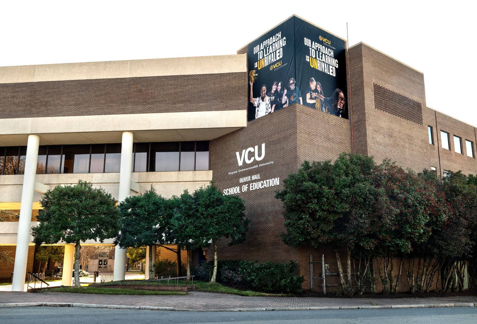 Oliver Hall exterior photo with uncommon banner