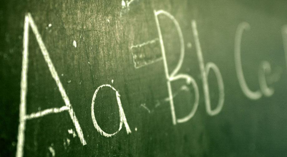 Green chalkboard with the letters A, B and C on it in upper and lower case.
