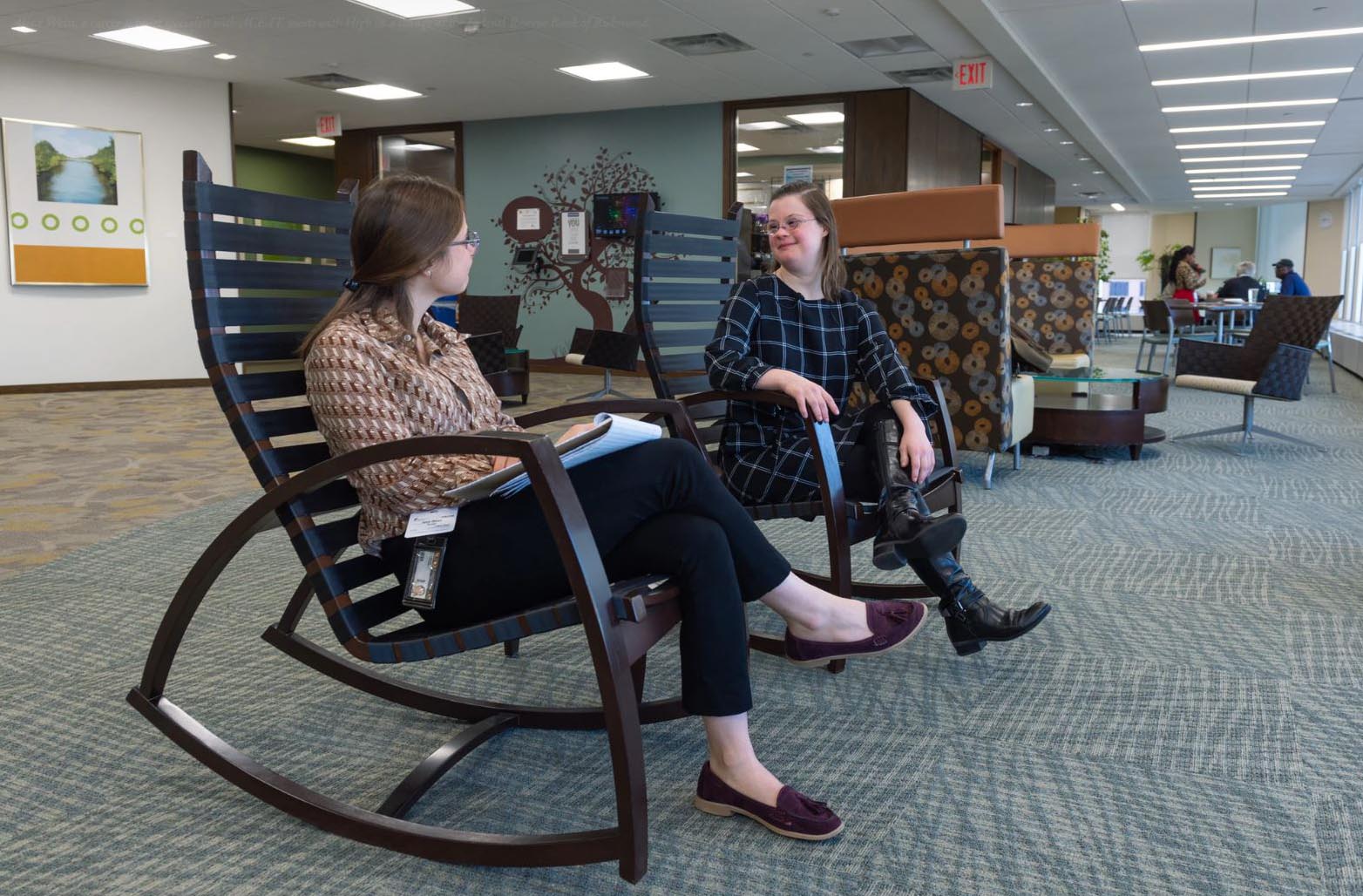 Aliza Weiss, a career support specialist with ACE-IT, meets with High in a lounge at the Federal Reserve Bank of Richmond.